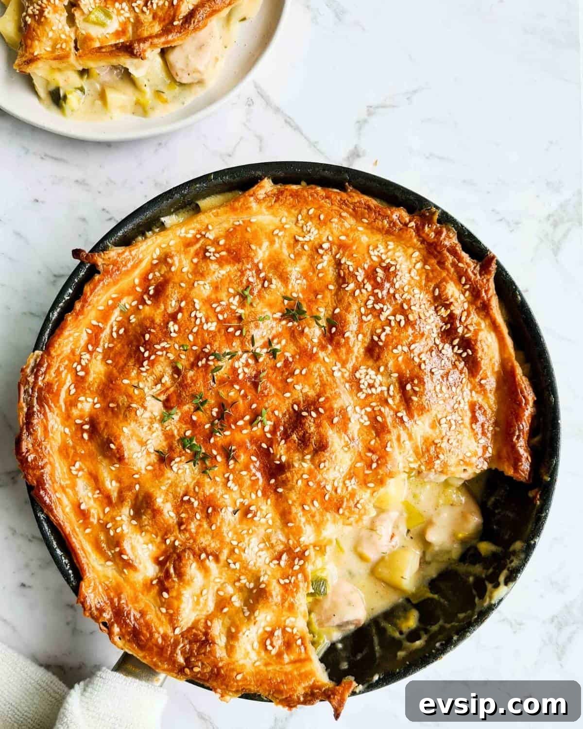 chicken pot pie with one serving being scooped out