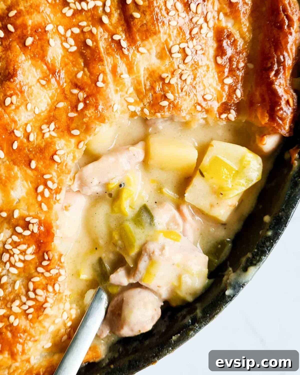 Close up of opened pie, revealing creamy filling
