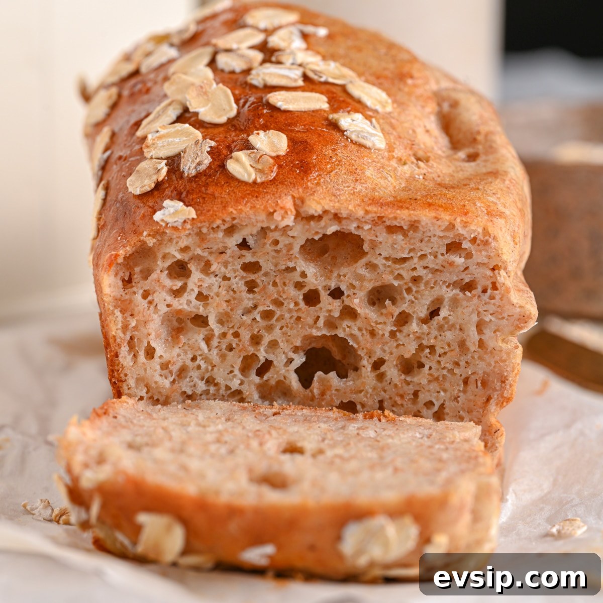 15 Delicious Cottage Cheese Recipes for Every Meal 13 Soft and fluffy cottage cheese bread, sliced. It features flakes of rolled oats on top.