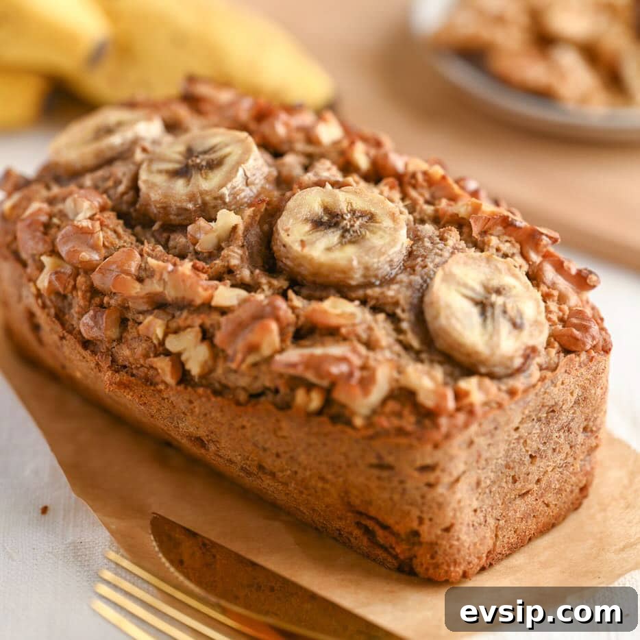 15 Delicious Cottage Cheese Recipes for Every Meal 25 Cottage cheese banana bread topped with sliced banana and crunchy walnuts, perfect as a cottage cheese dessert for weight loss or to build muscle