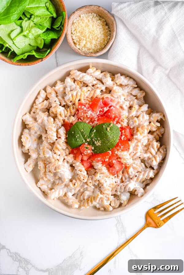 15 Delicious Cottage Cheese Recipes for Every Meal 29 High Protein Cottage Cheese Pasta Sauce Served With Diced Tomatoes, Parmesan and Basil Leaves