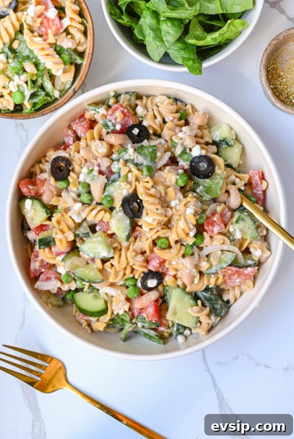 15 Delicious Cottage Cheese Recipes for Every Meal 30 High Protein Pasta Salad in a plate, shown from the top. This cold summer dish is loaded with summer vegetables, protein-packed cottage cheese and beans, and a creamy dressing that is low calorie and high in vegetarian protein