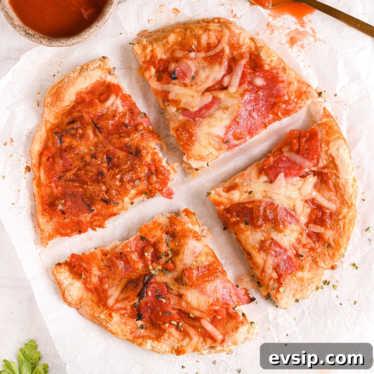 15 Delicious Cottage Cheese Recipes for Every Meal 9 Cottage cheese pizza crust sliced into quarters, perfect as a low carb and low calorie protein dinner or lunch after a workout