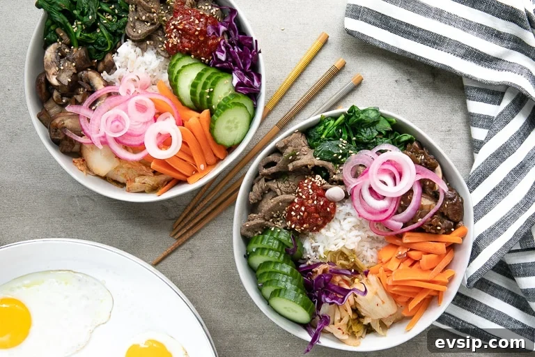 Korean Beef Bibimbap Recipe: Authentic Mixed Rice Bowl 3 Overhead of bibimbap bowls with all the sides