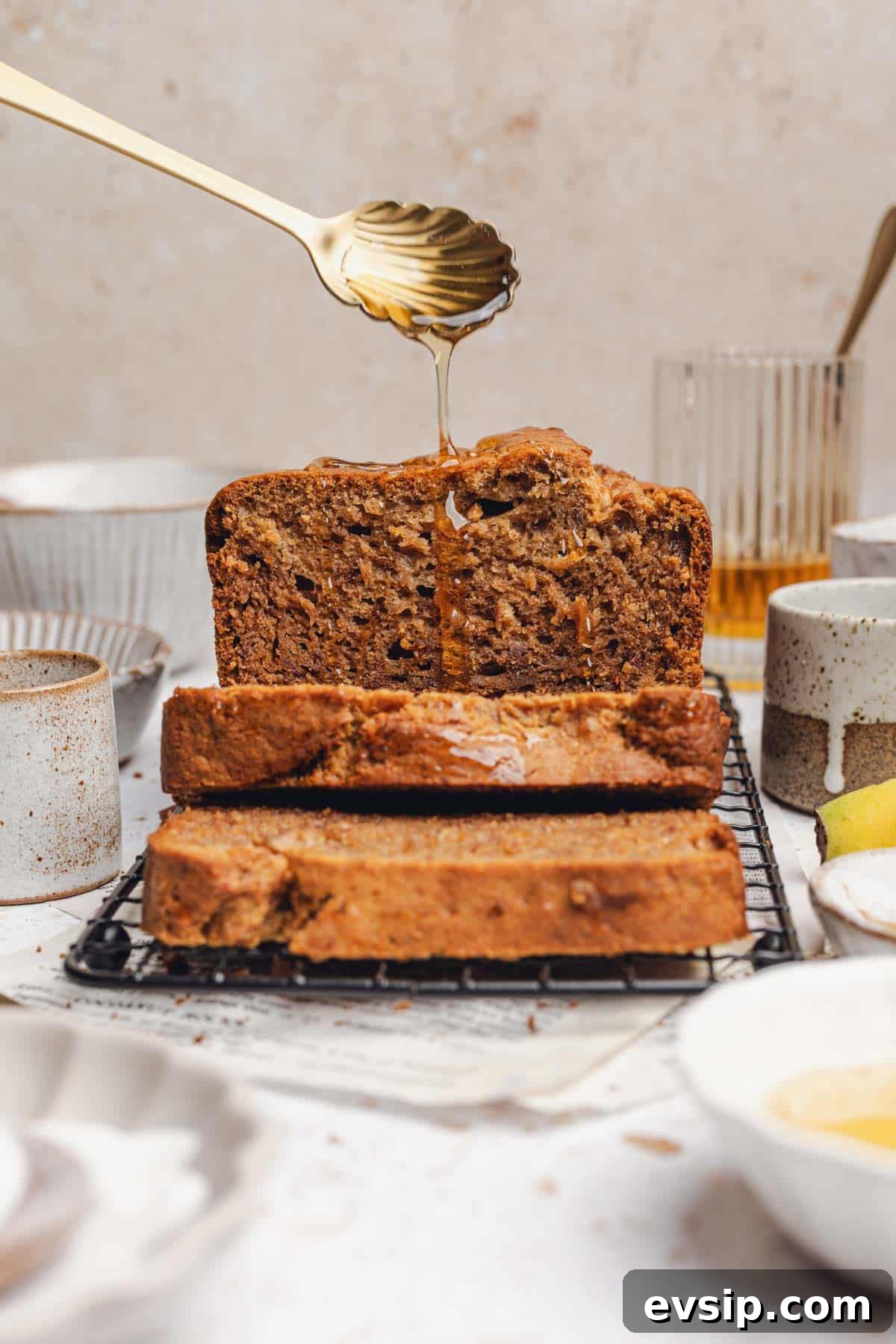 drizzling honey on sliced banana bread. 