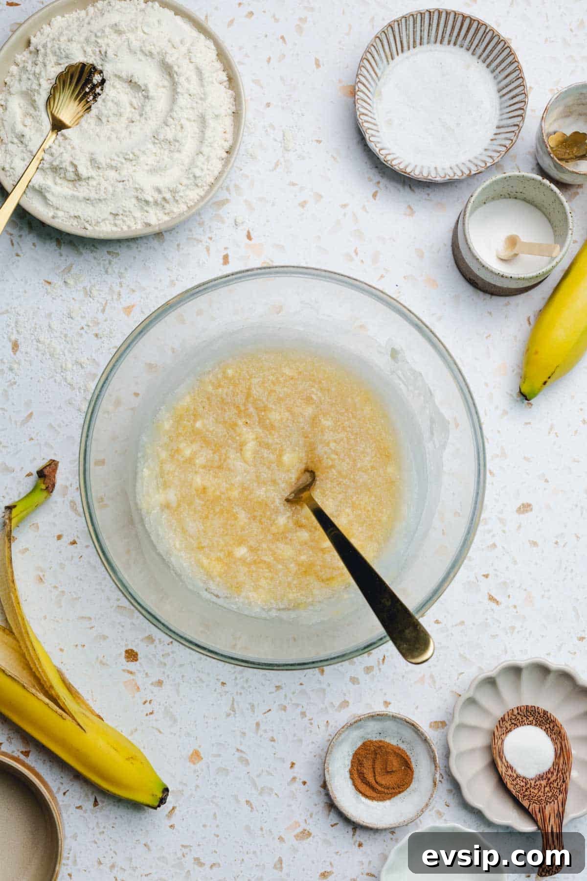 a bowl of mixed banana, oil, and honey. 