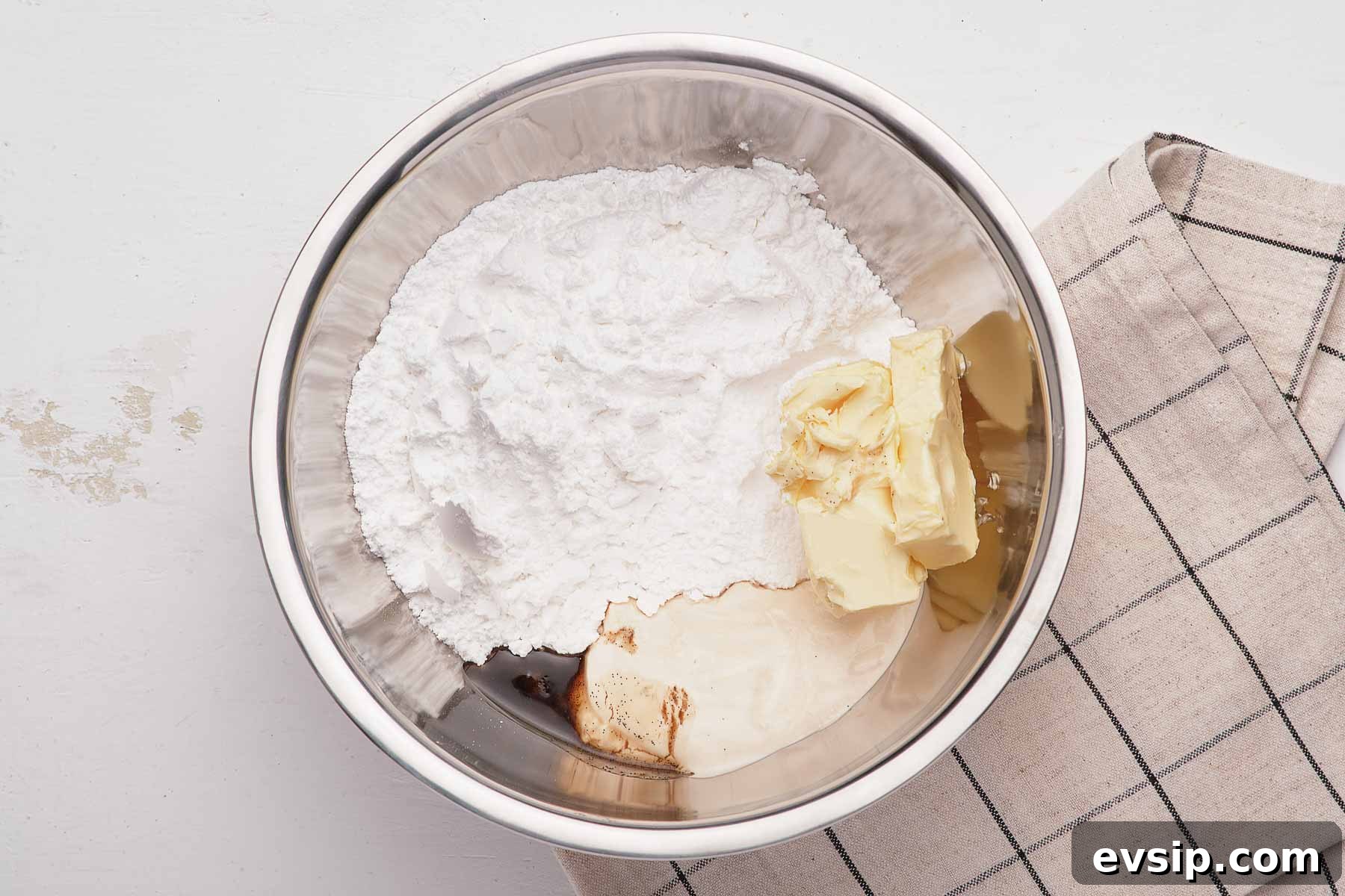 Frosting ingredients in a silver bowl.