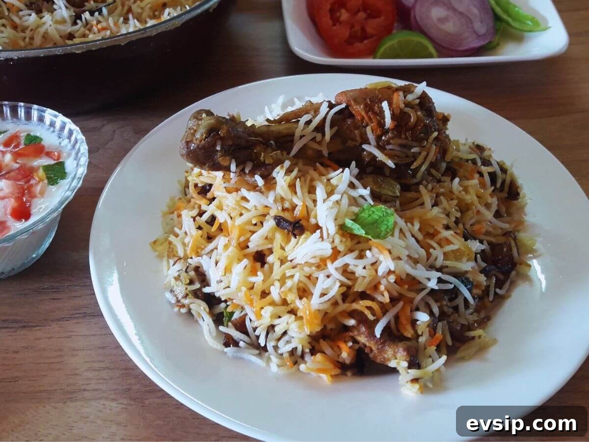 Lucknowi Awadhi Chicken Biryani Recipe — Authentic Taste Guide 2 close-up of awadhi chicken biryani served on a plate.