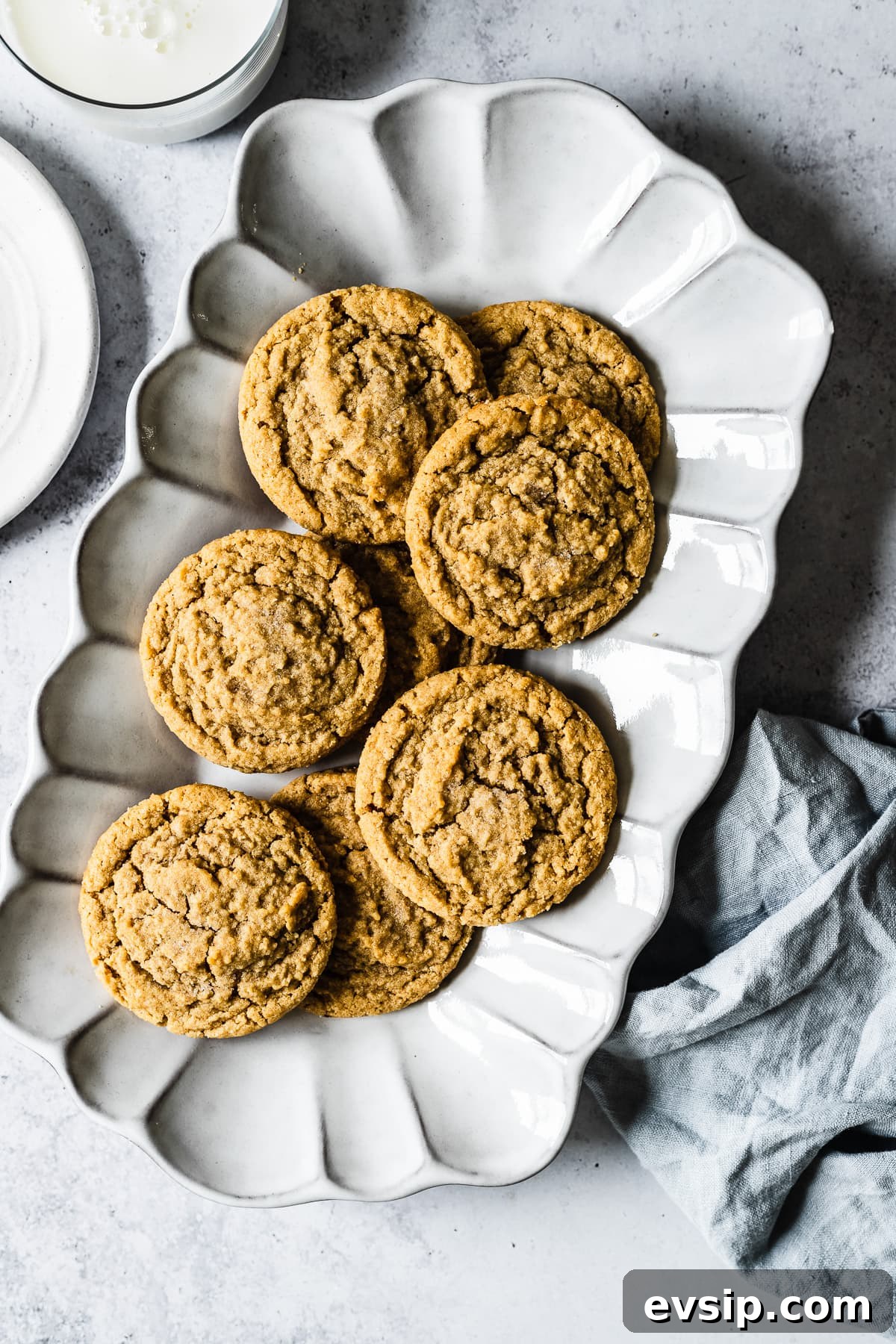 Peanut butter cookies on a fluted plate.