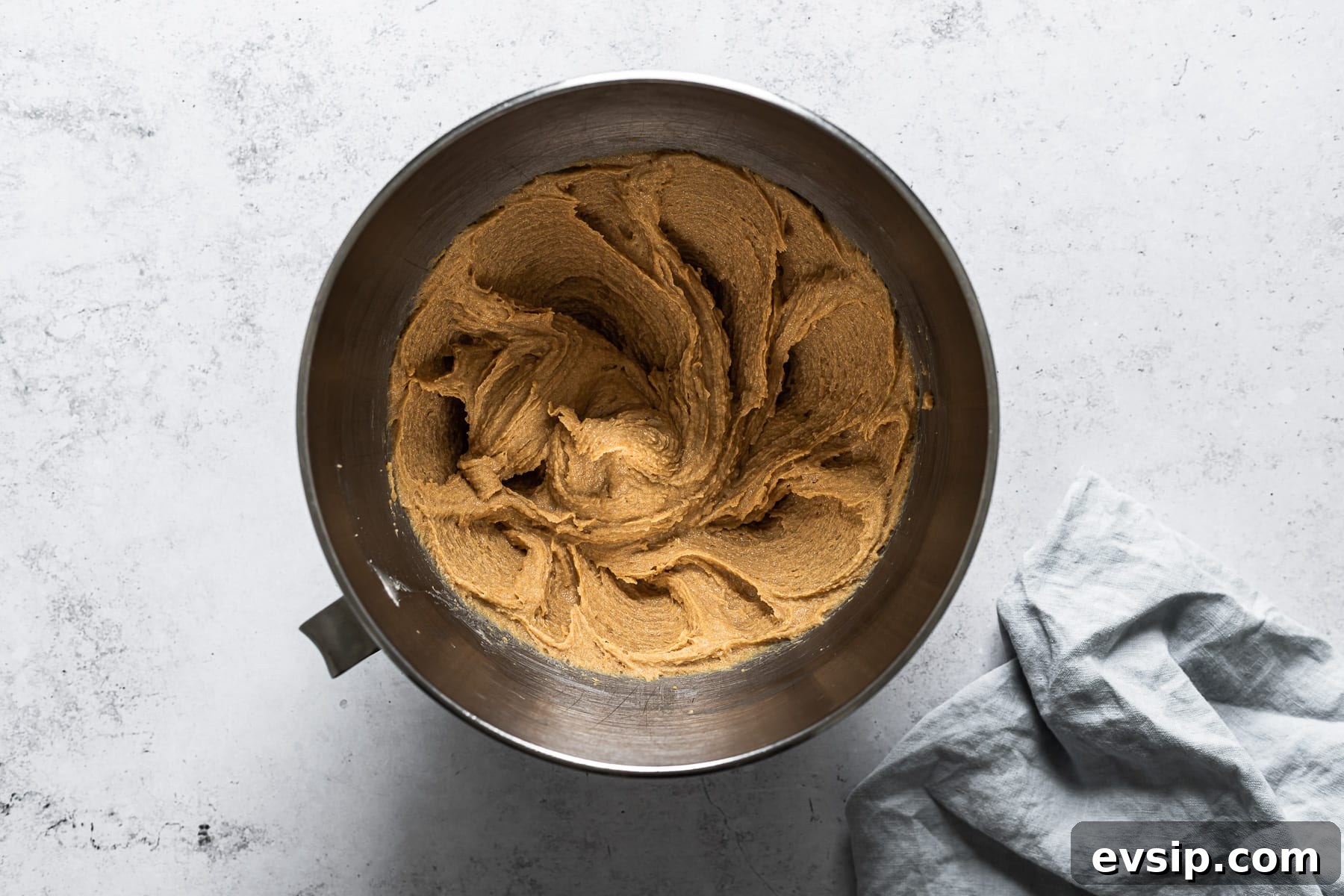 Process photo of cookie dough with wet ingredients mixed in.