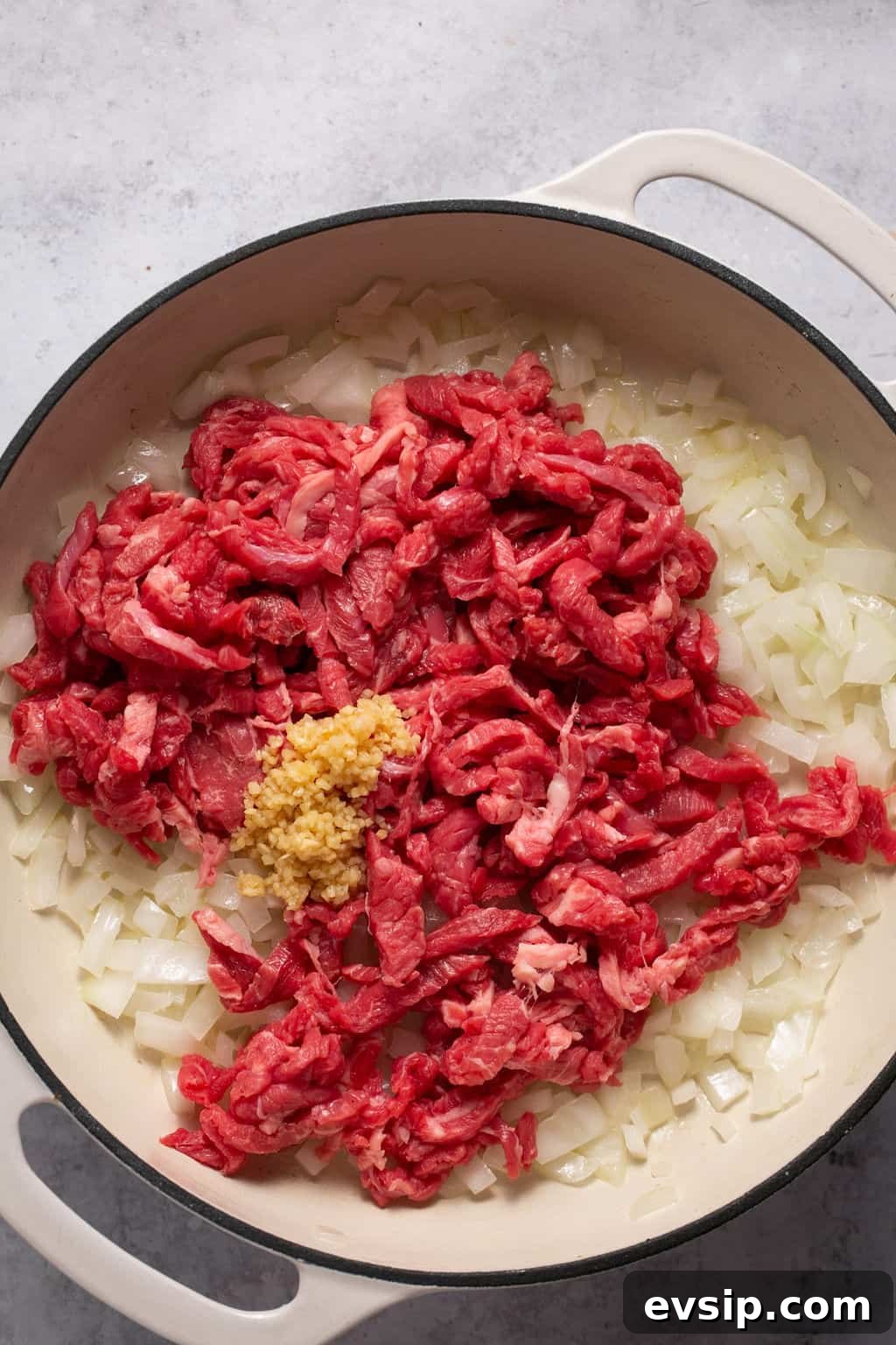 onions and meat in pan