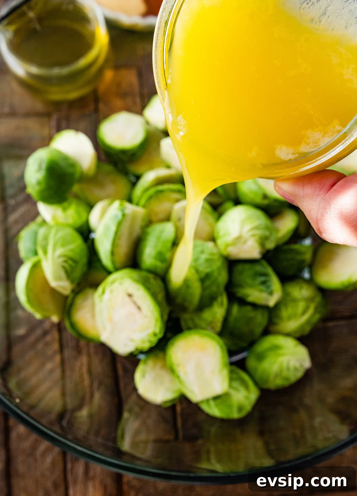 How to make Parmesan Brussels Sprouts Recipe step-by-step with photos: season the sprouts with oil and butter.