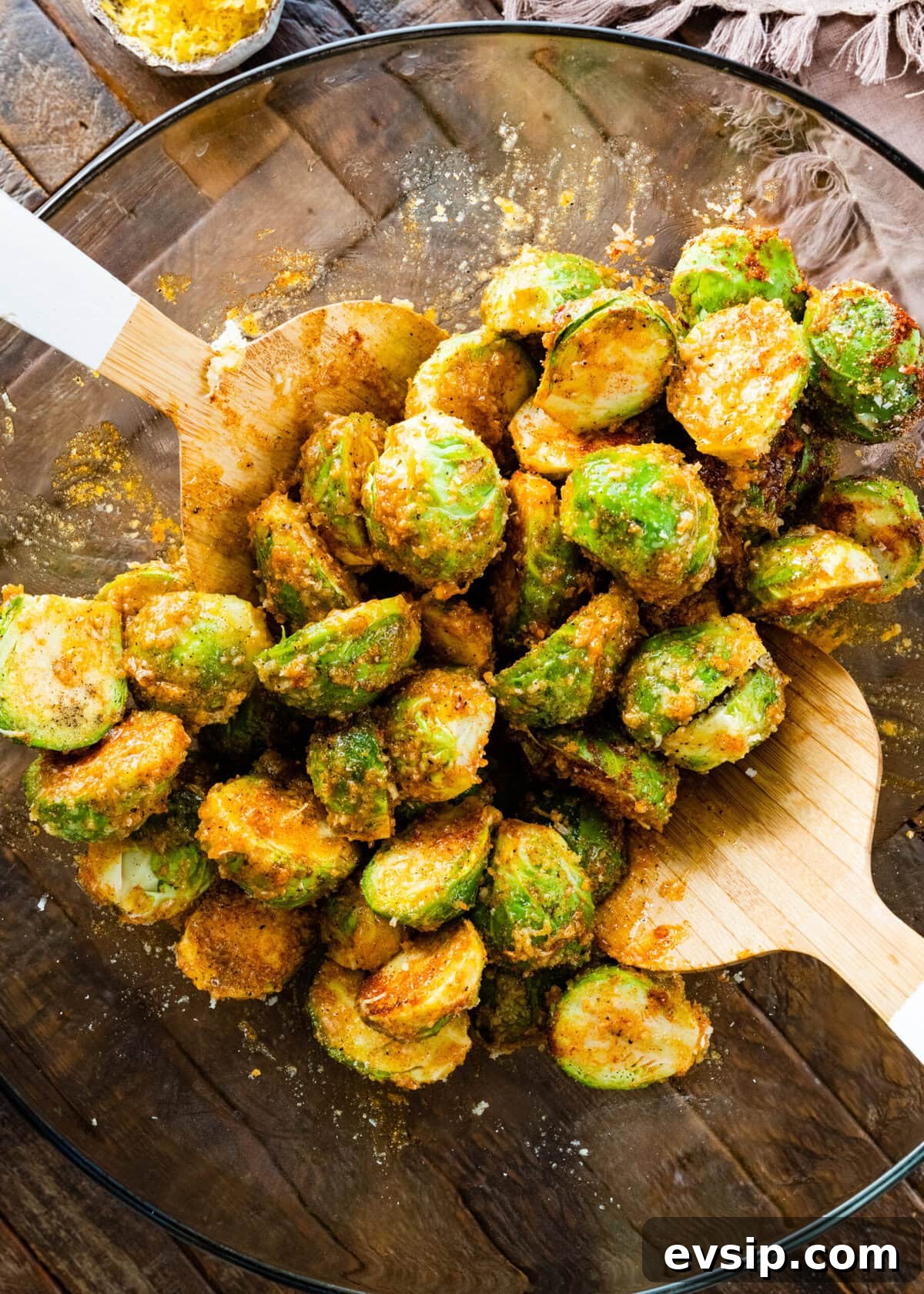 How to make Parmesan Brussels Sprouts Recipe step-by-step with photos: toss the Brussels and the seasoning in a bowl.
