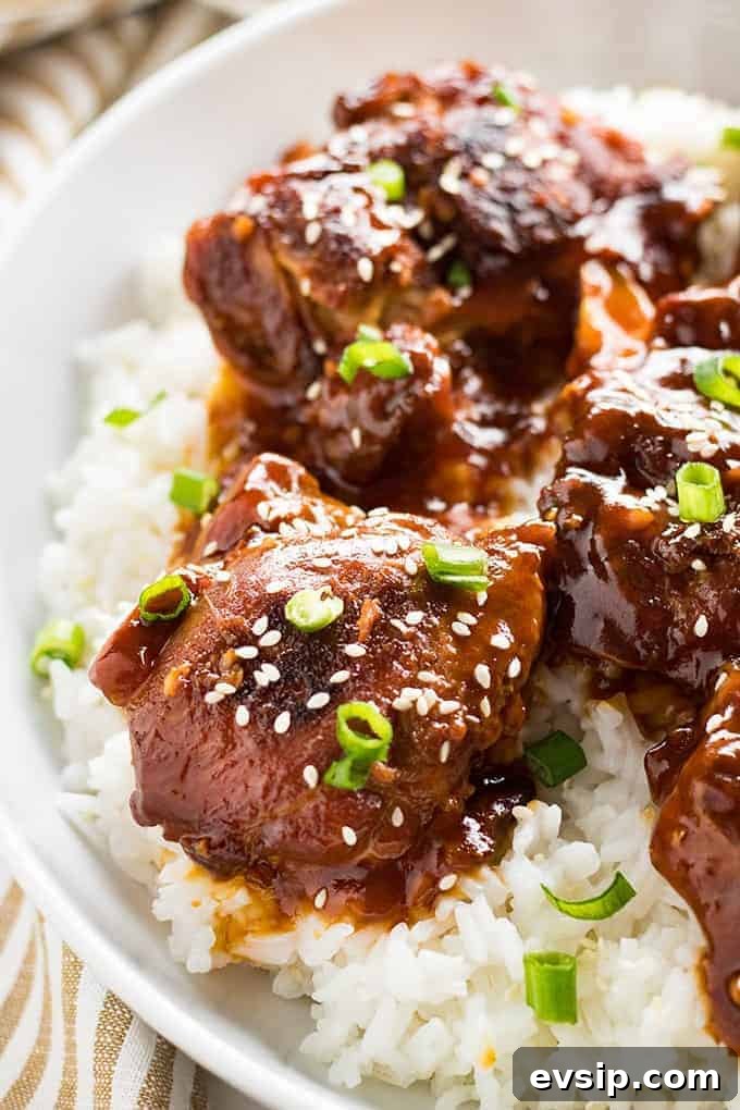 honey sesame instant pot chicken thighs served over rice