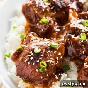 honey sesame instant pot chicken thighs served over rice