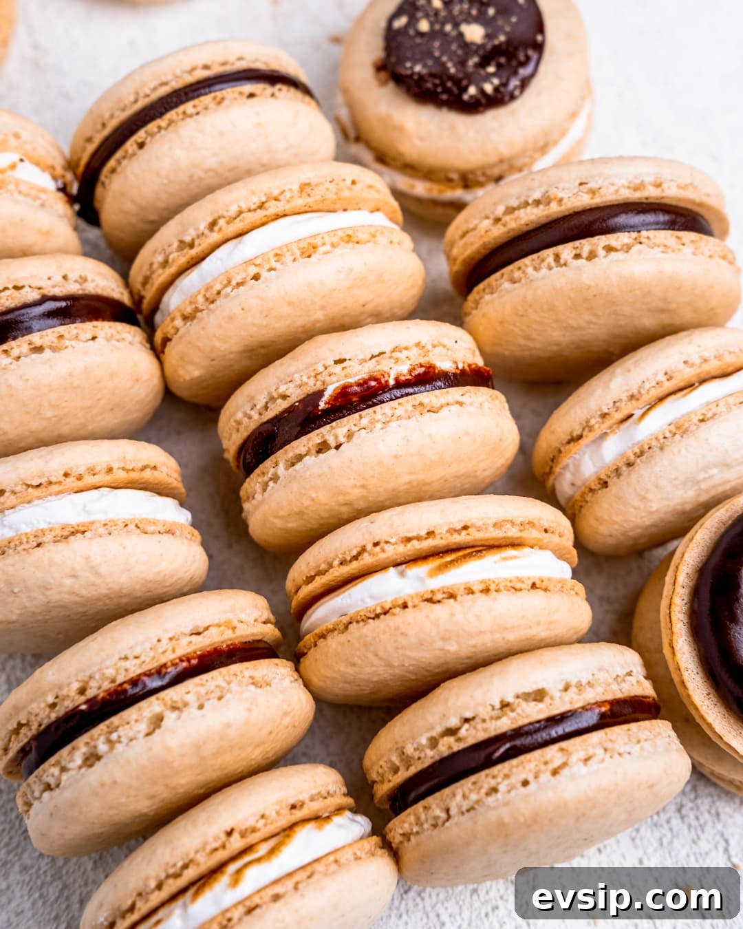 Columns of s'mores macarons laying on their sides.