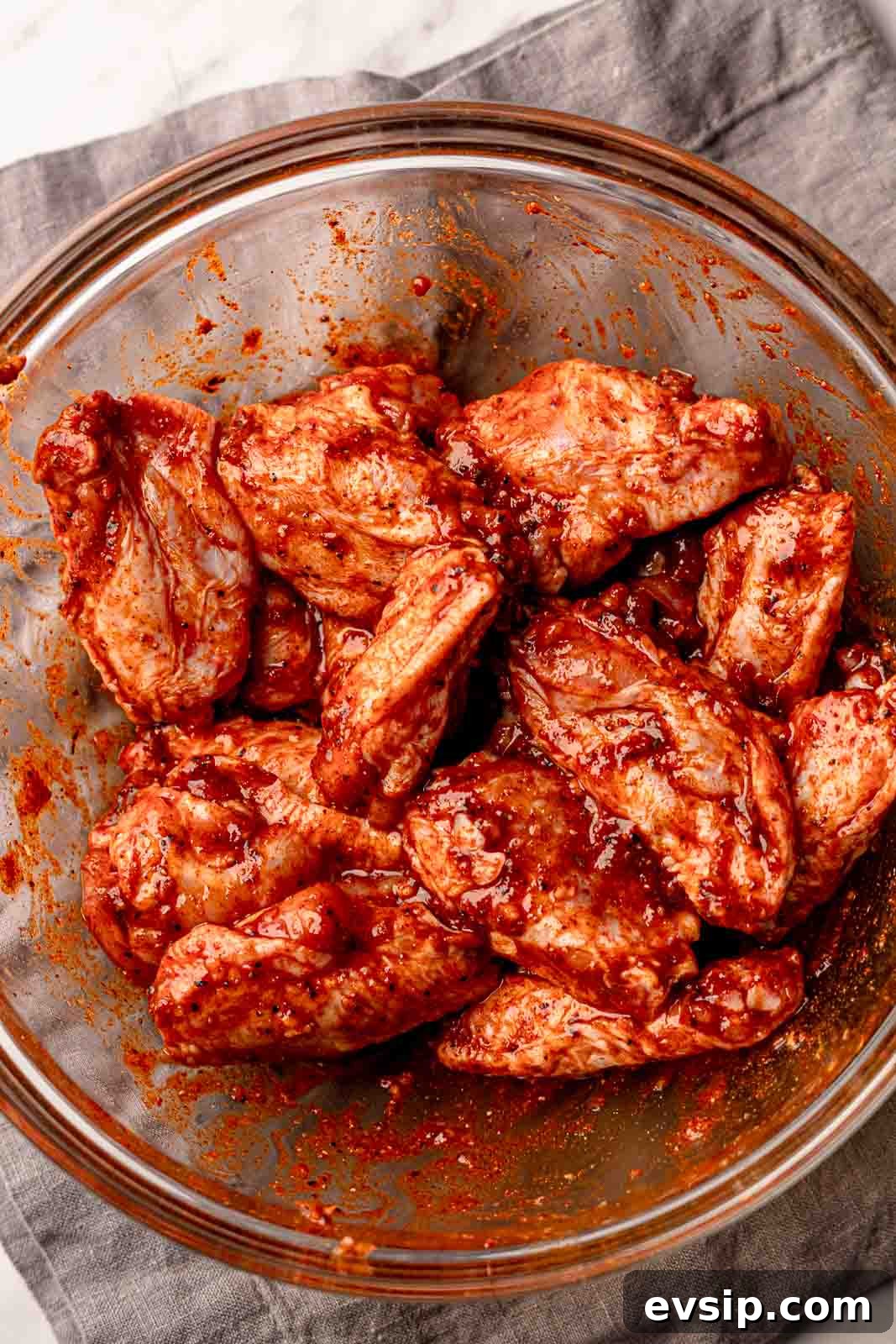 Wings in a bowl with spices.