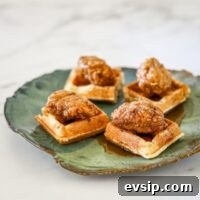 fried chicken served on waffle pieces as a snack.