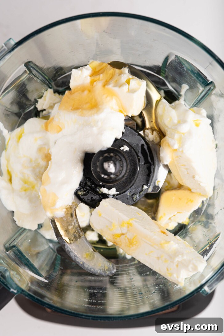 Whipped feta ingredients in a food processor.