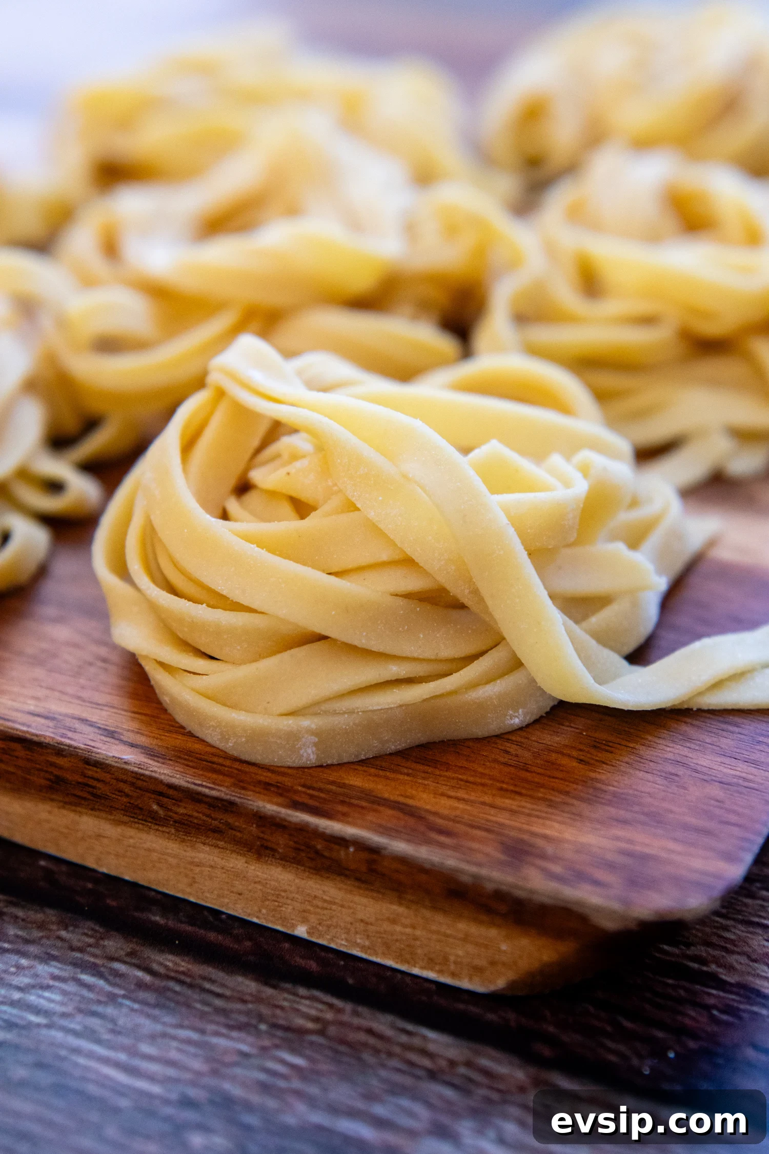 Gluten-Free Pasta folded sitting on a cutting board. 