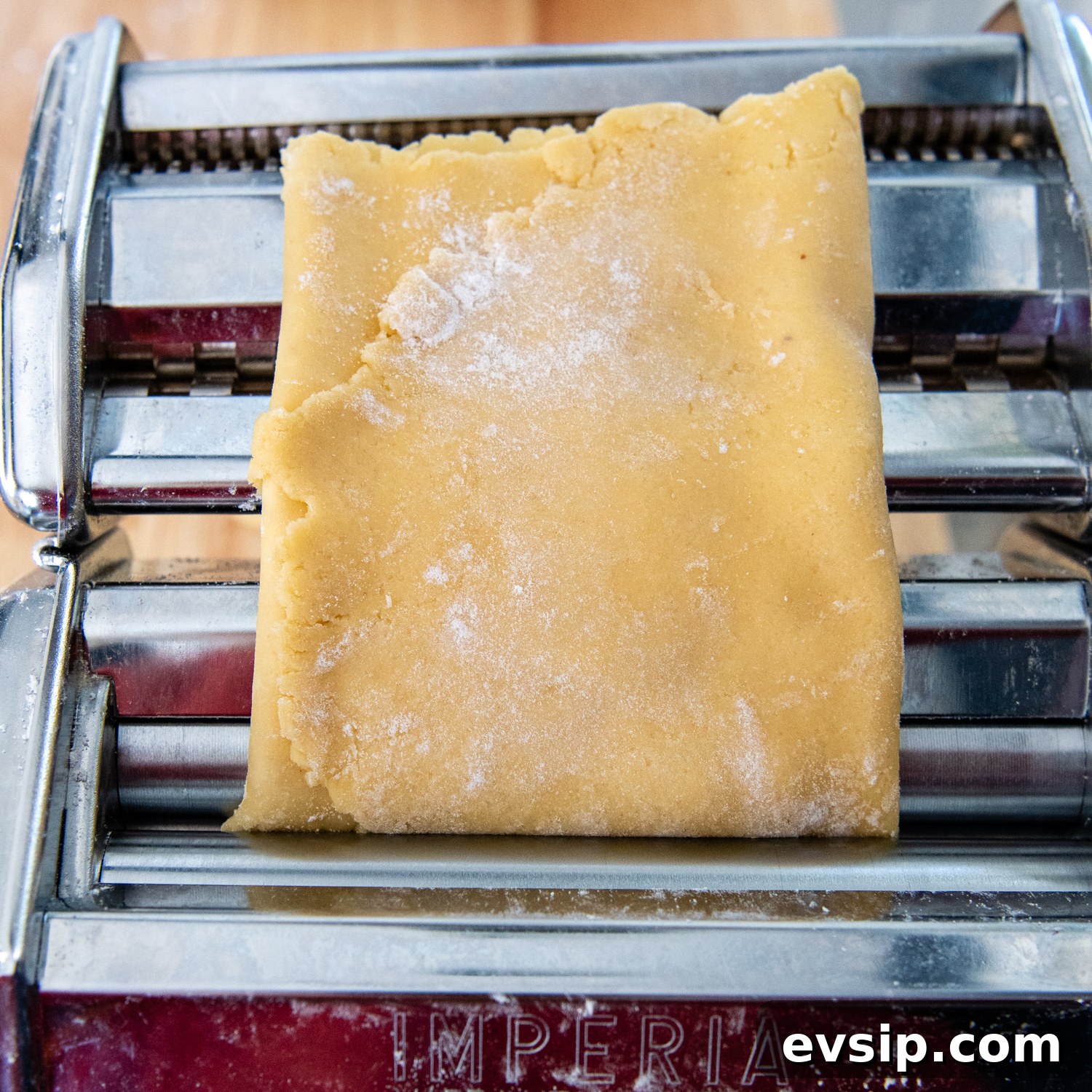 dough turned and going through pasta machine again.