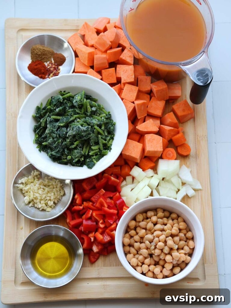 ingredients on chopping block for spiced sweet potato and spinach soup