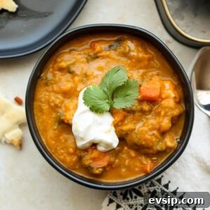 square image of spiced sweet potato spinach soup