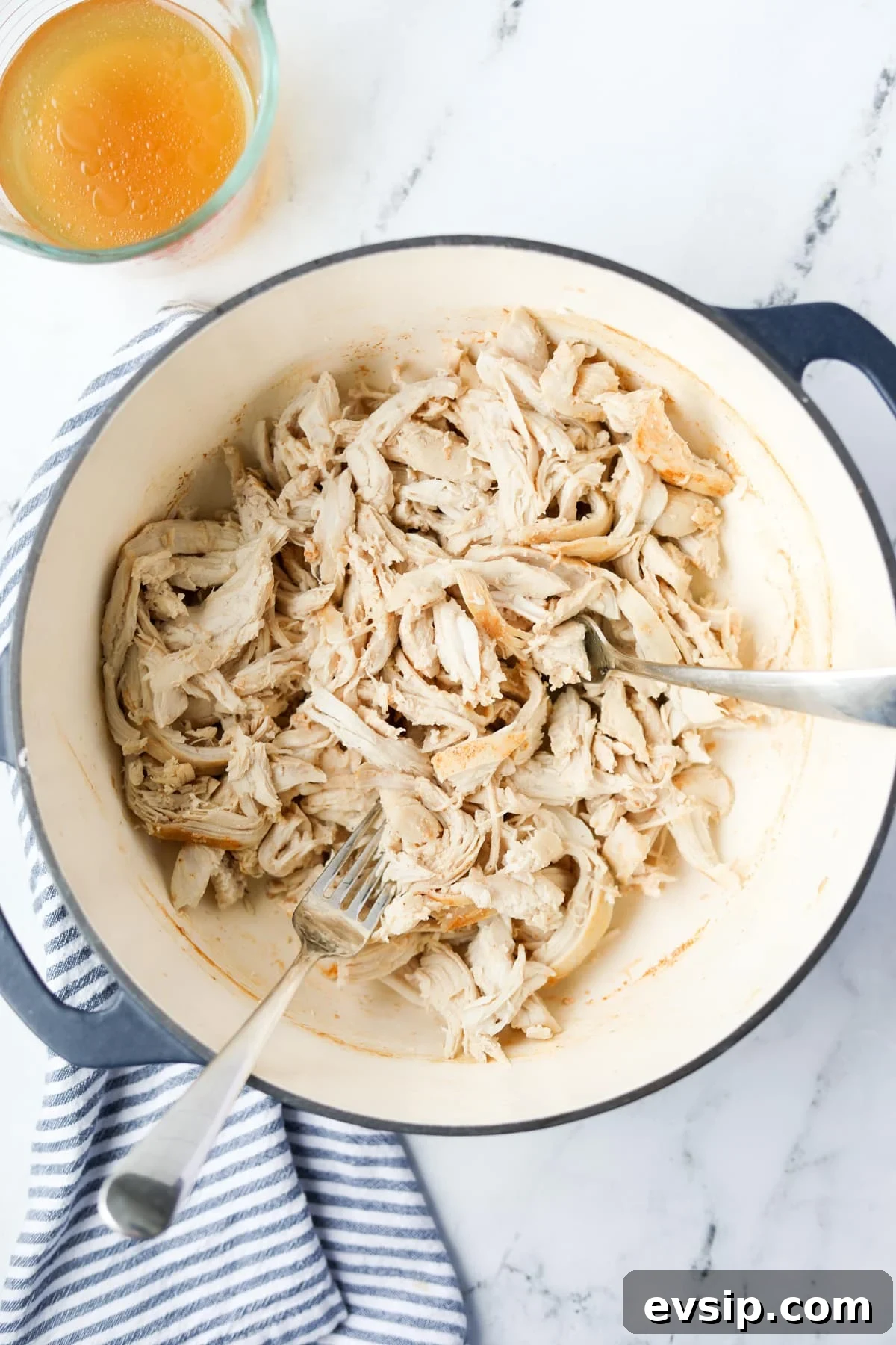 Juicy Shredded Chicken Made in a Dutch Oven 8 A Dutch Oven filled with shredded chicken.