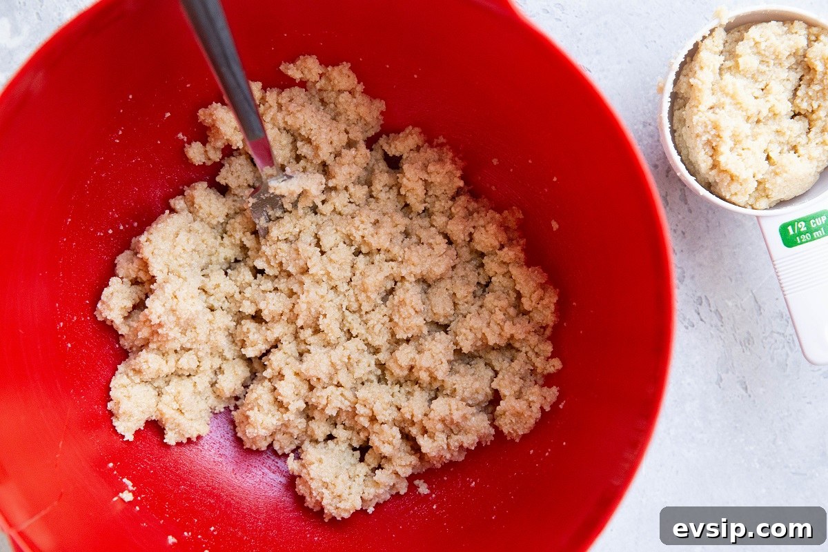 Gluten-Free Vegan Blackberry Pie Bars — 5 Ingredients 5 Almond flour shortbread crust in a red mixing bowl, ready to be made into bars.