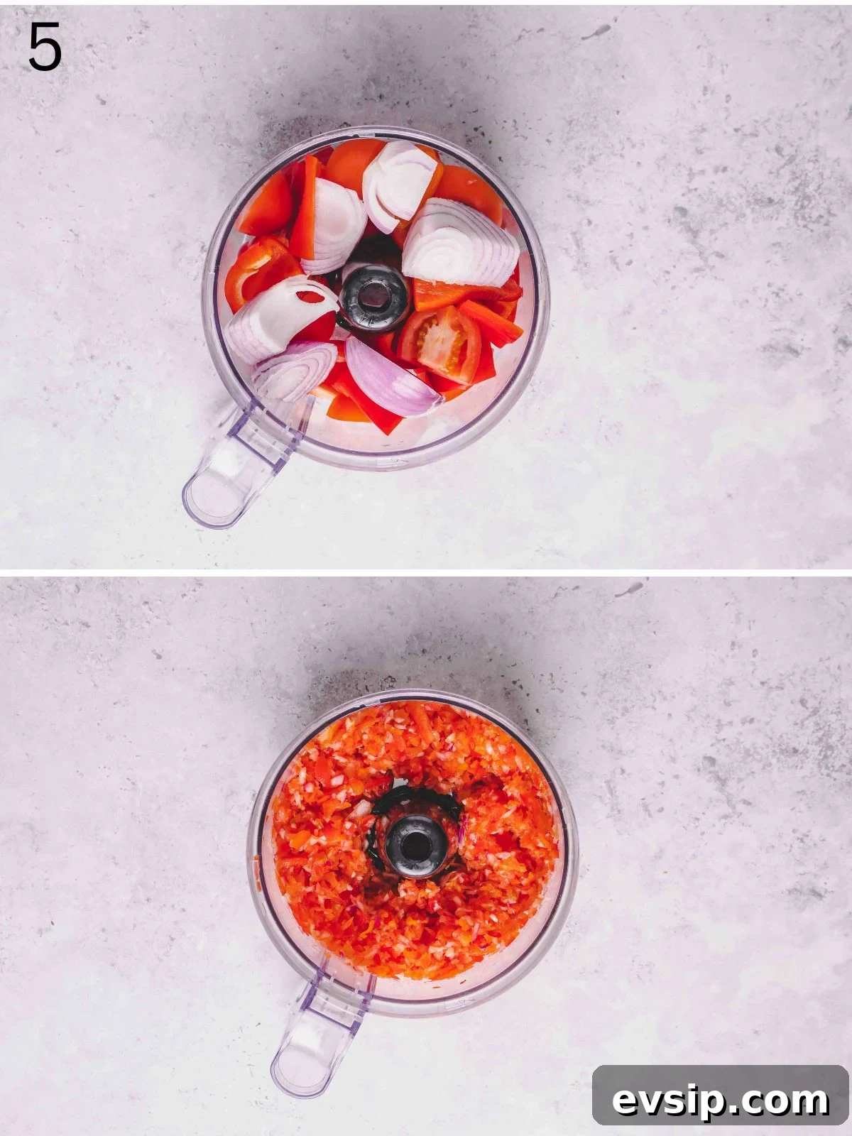 Roughly chopped peppers and onion inside a food processor bowl.