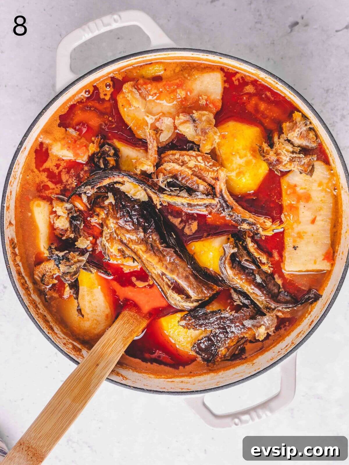 adding the rest of the ingredients into the pot with yam.