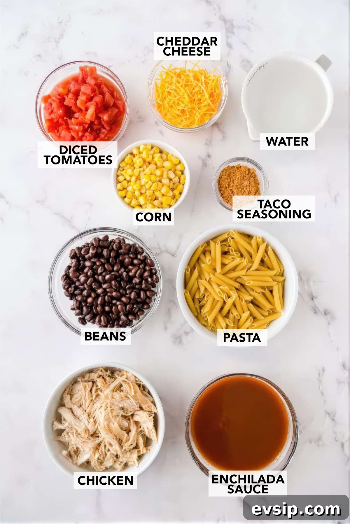 30-Minute One-Pot Chicken Enchilada Pasta Recipe 3 Ingredients for chicken enchilada pasta including chicken, pasta, black beans, corn, diced tomatoes, enchilada sauce and cheese