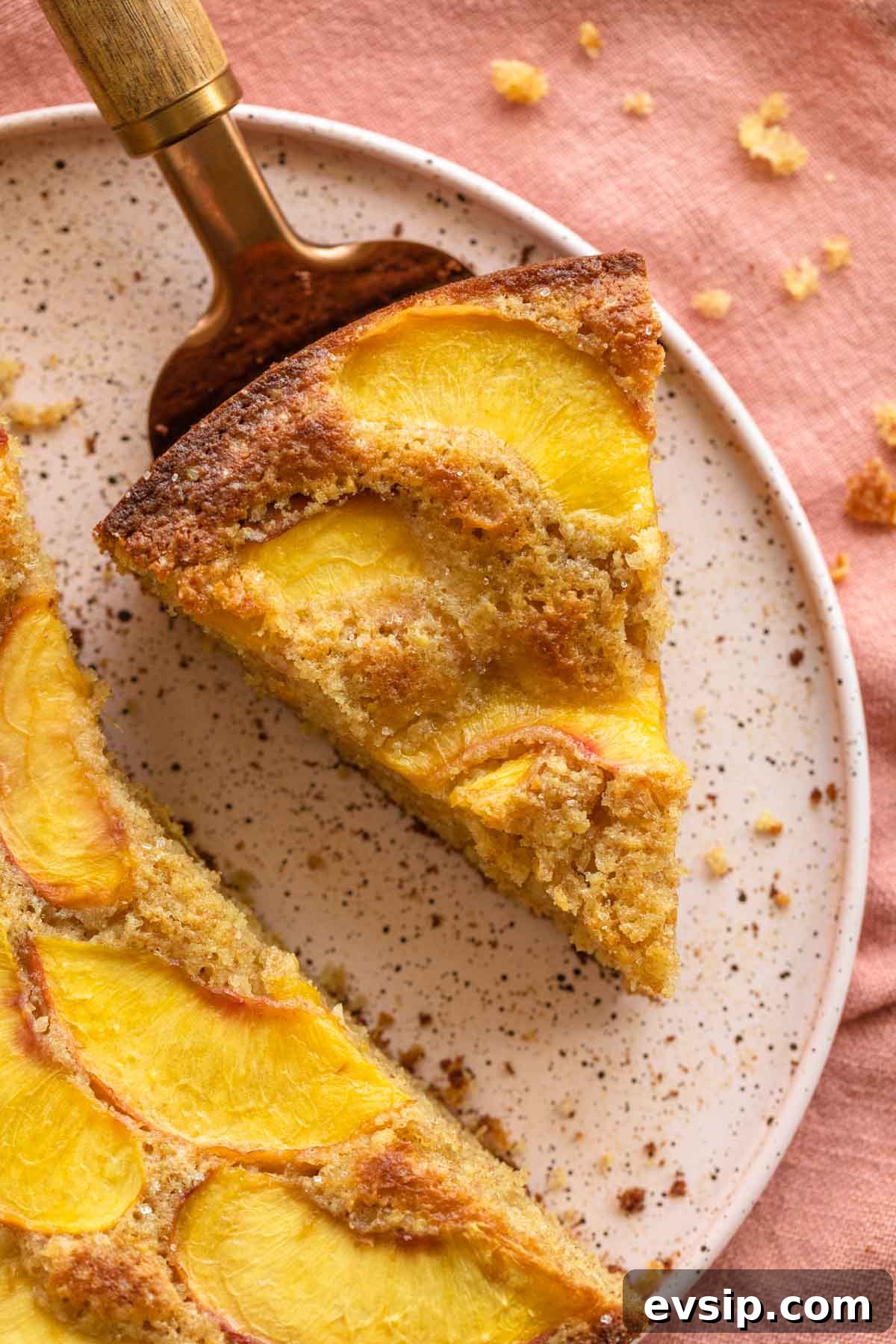 Peach Ricotta Cake Recipe — Moist Summer Fruit Dessert 2 Up close of a slice of peach cake.