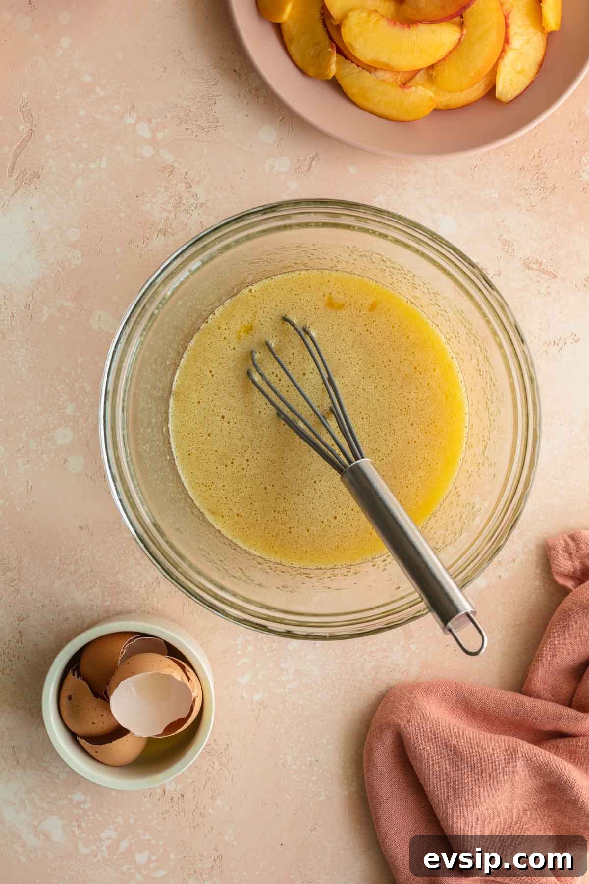 Peach Ricotta Cake Recipe — Moist Summer Fruit Dessert 4 Wet ingredients being whisked together in a glass bowl.
