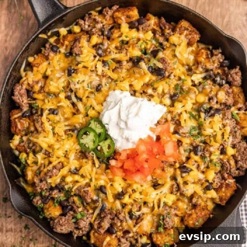 Top Blackstone Griddle Appetizers for Parties and Game Day 11 Taco casserole in a skillet.