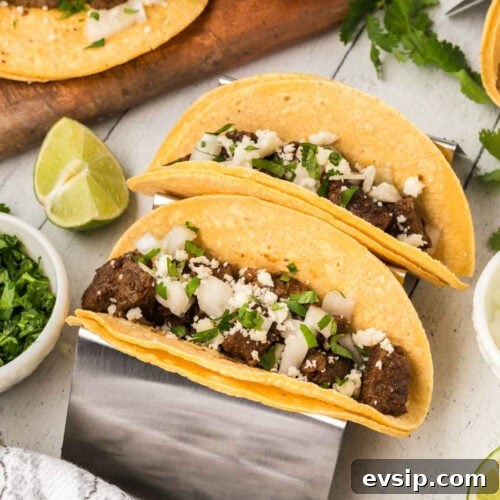 Top Blackstone Griddle Appetizers for Parties and Game Day 18 Mexican beef tacos on a cutting board.
