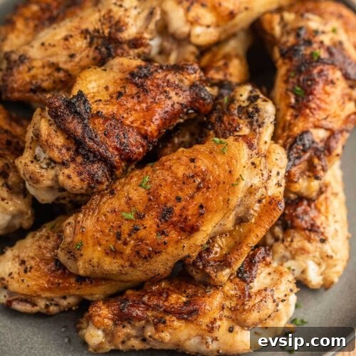 Top Blackstone Griddle Appetizers for Parties and Game Day 7 Grilled chicken wings on a plate.