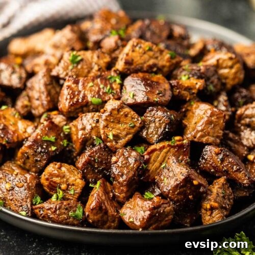 Top Blackstone Griddle Appetizers for Parties and Game Day 9 Crispy beef in a black bowl.