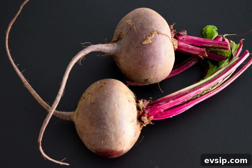 two beets on black background