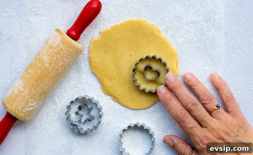 cutting out linzer cookies