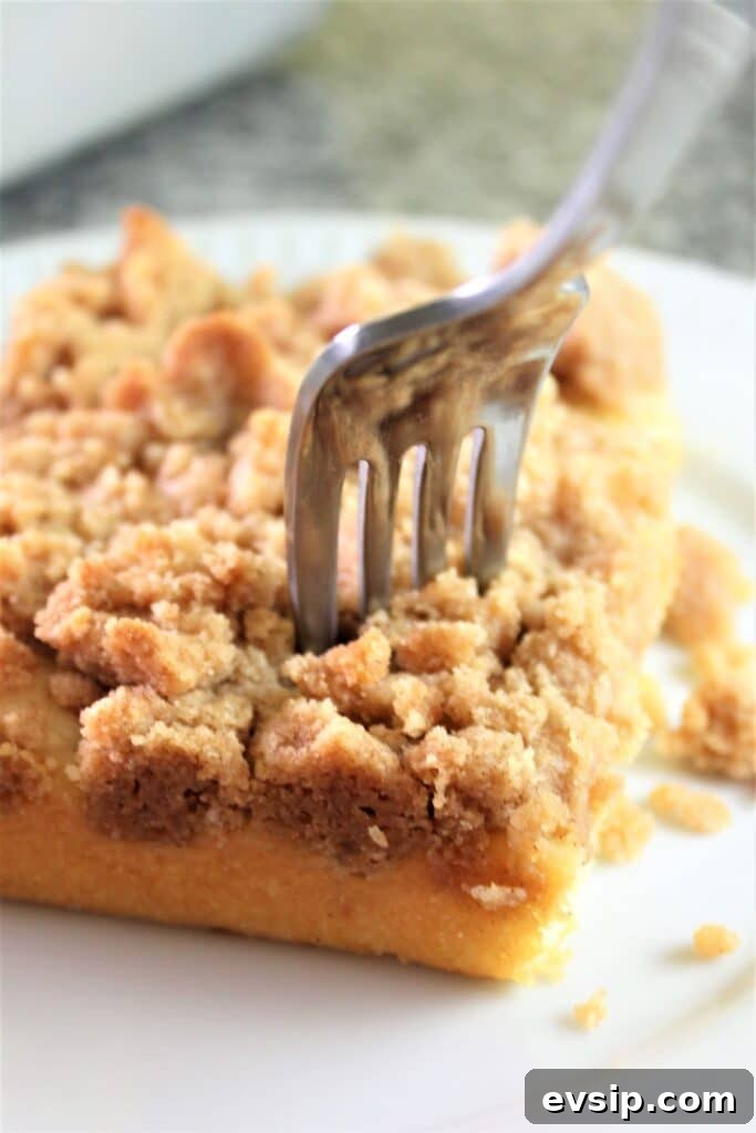 gluten free crumb cake piece with a fork in it