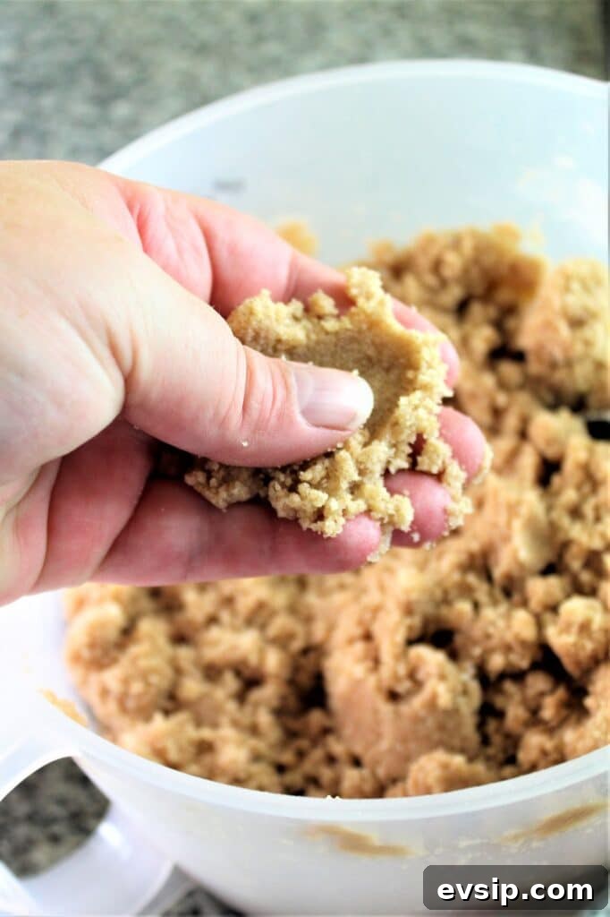 squeezing crumbs together with fingers