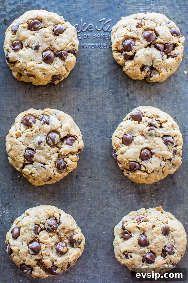 Chewy Chocolate Chip & Peanut Butter Chip Cookie Recipe 16 Six peanut butter cowboy cookies on a baking sheet.