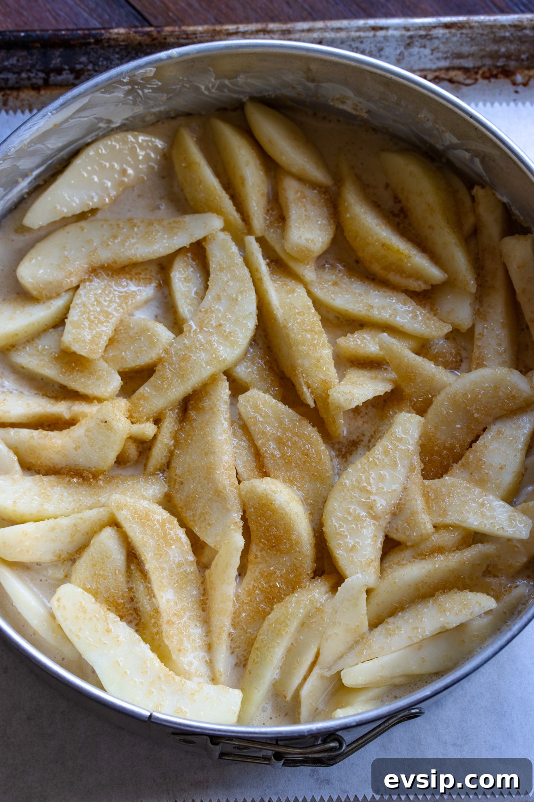 pears and batter in the springorm mold ready to go in the oven