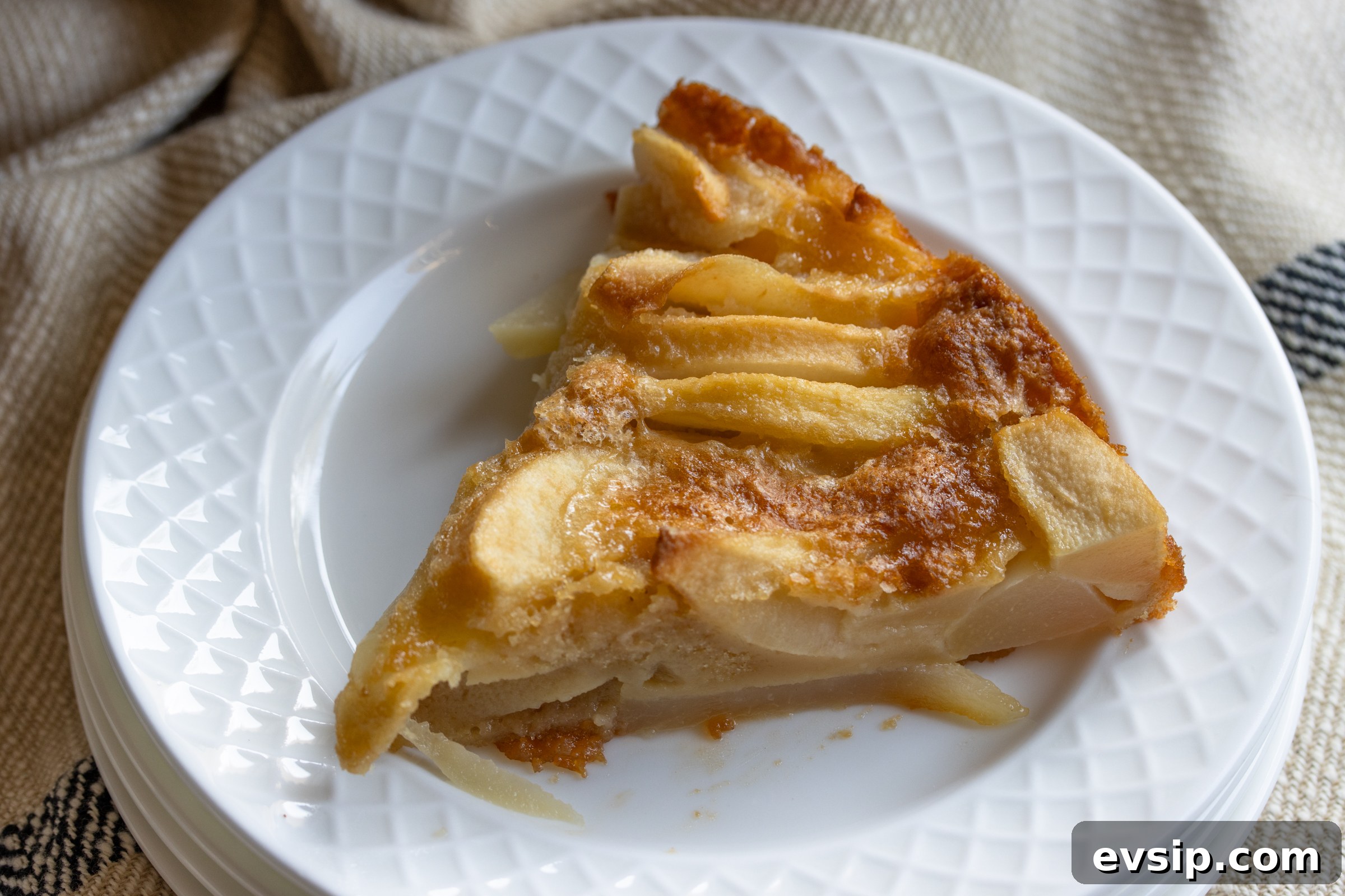 slice of pear cake on a white plate