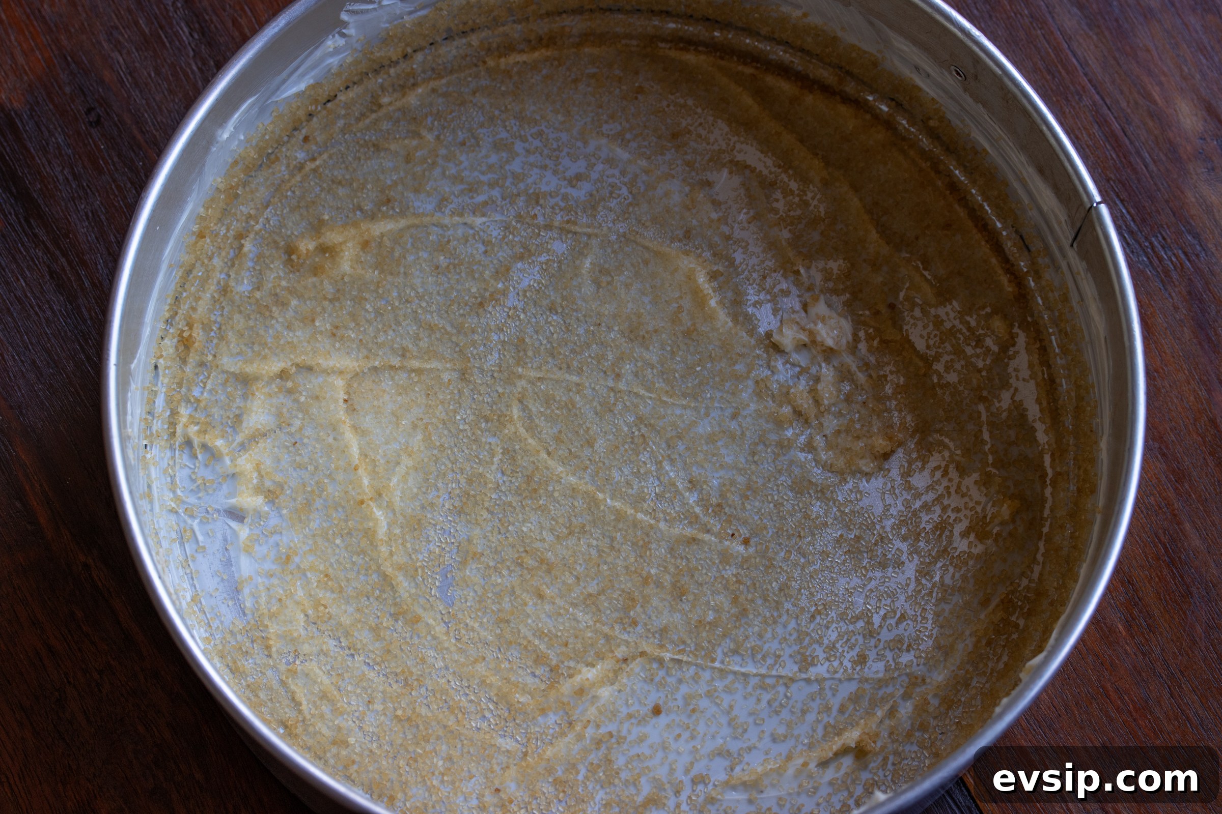 buttered springform mold and turbinado sugar sprinkled over it