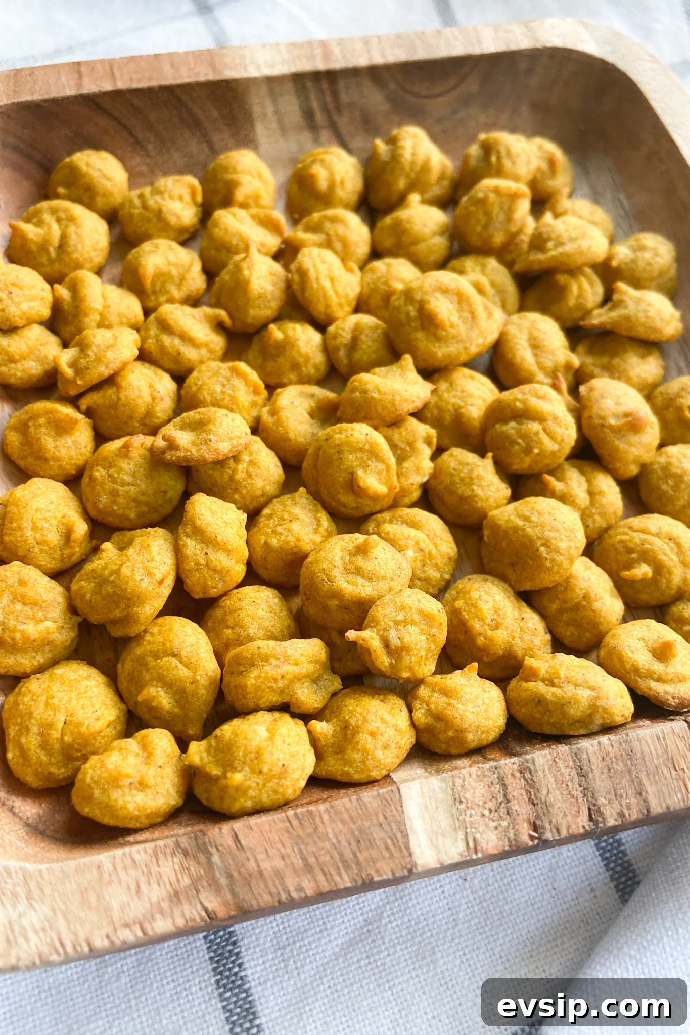 15 Kid-Friendly Pumpkin Recipes for Fall 15 Pumpkin puffs served on a wooden plate