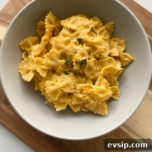 15 Kid-Friendly Pumpkin Recipes for Fall 18 Creamy pumpkin pasta garnished with parsley flakes. Served in a gray bowl.