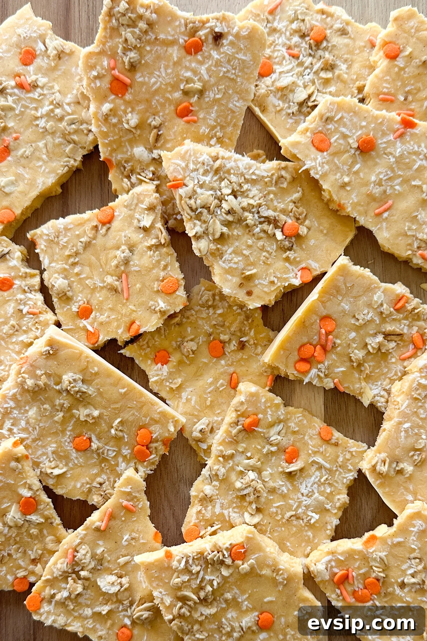 15 Kid-Friendly Pumpkin Recipes for Fall 23 Pumpkin yogurt bark on a wooden board.
