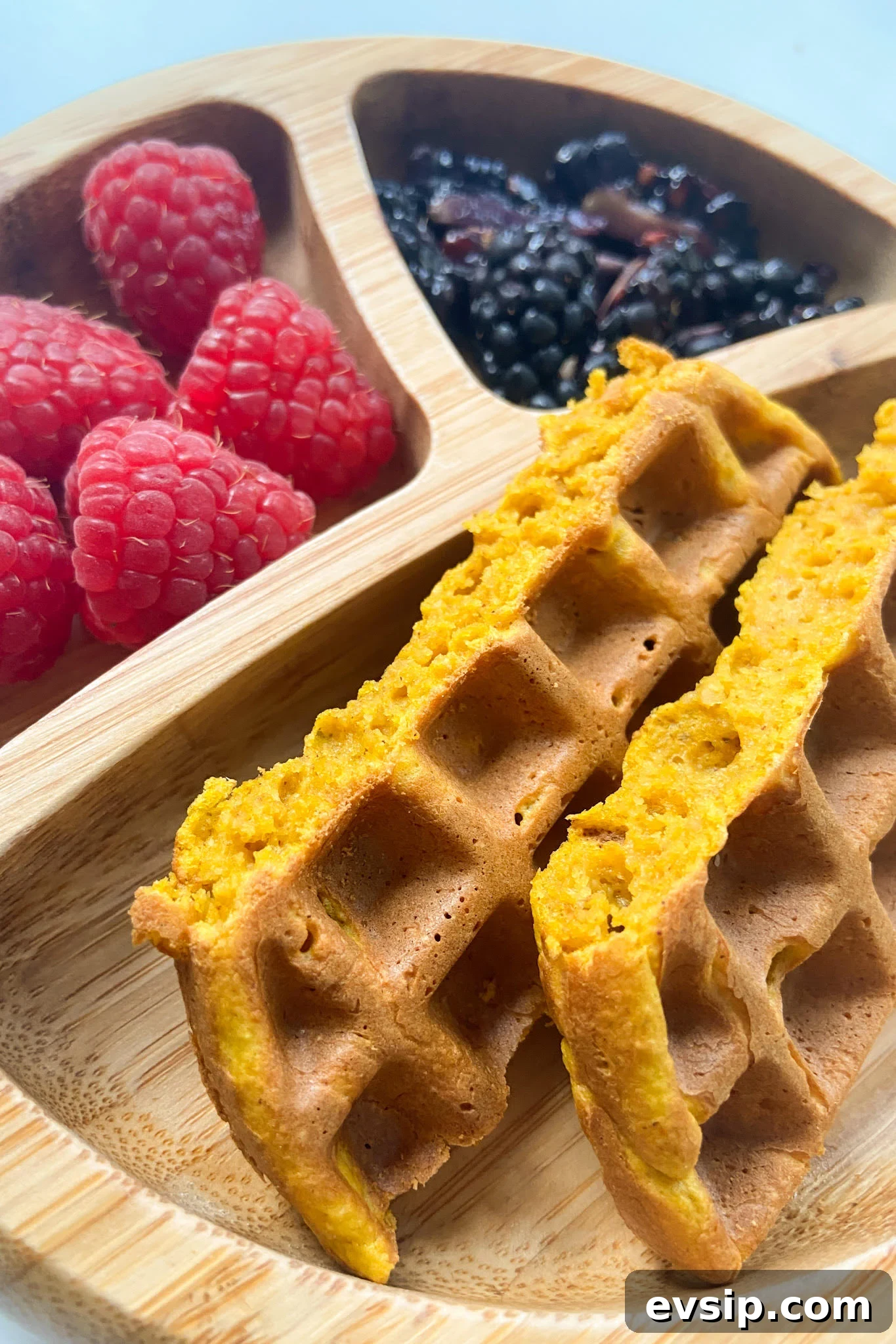 15 Kid-Friendly Pumpkin Recipes for Fall 5 Pumpkin waffles served with raspberries and blackberries